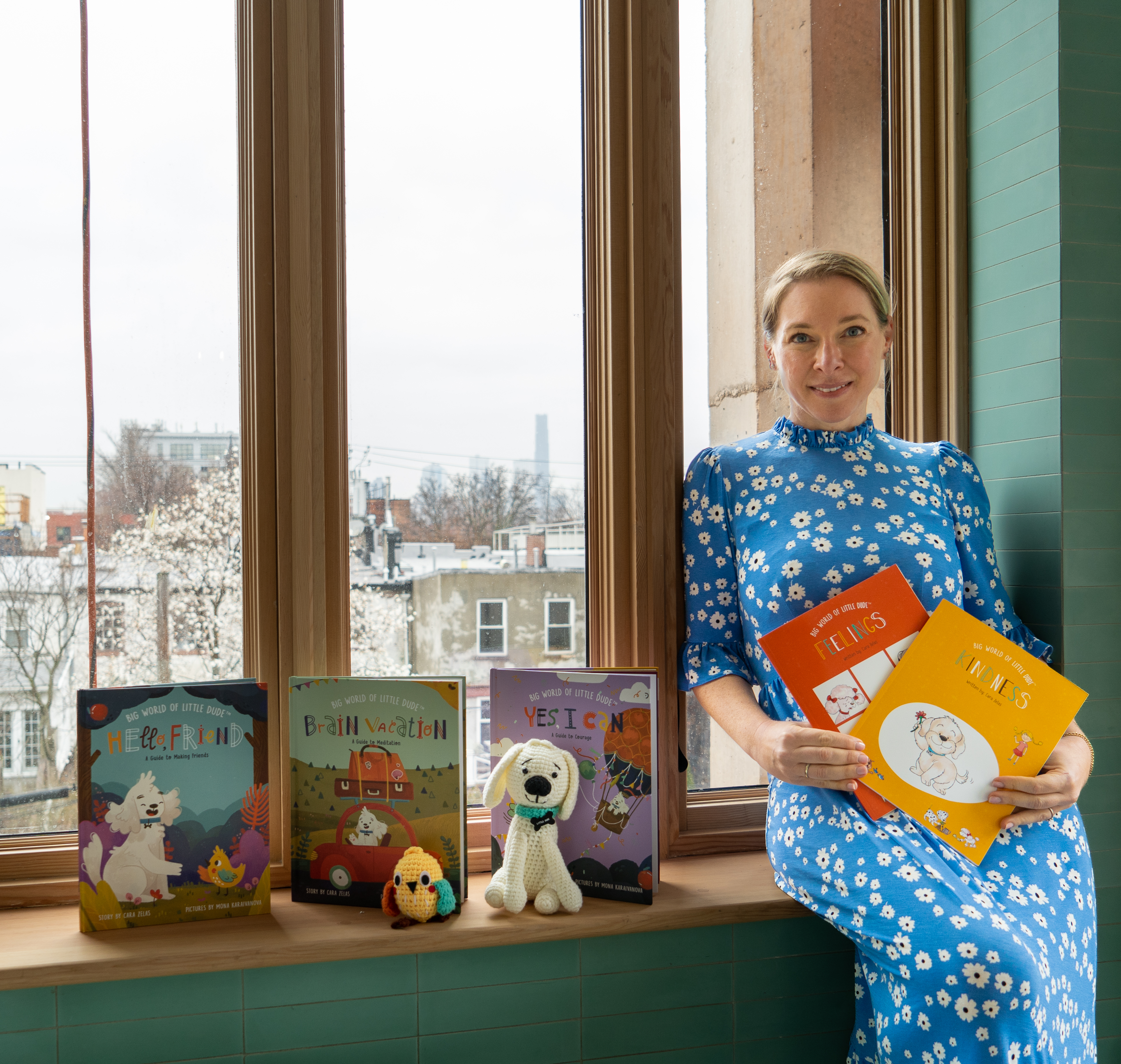 Cara Zelas with the Big World of Little Dude book series