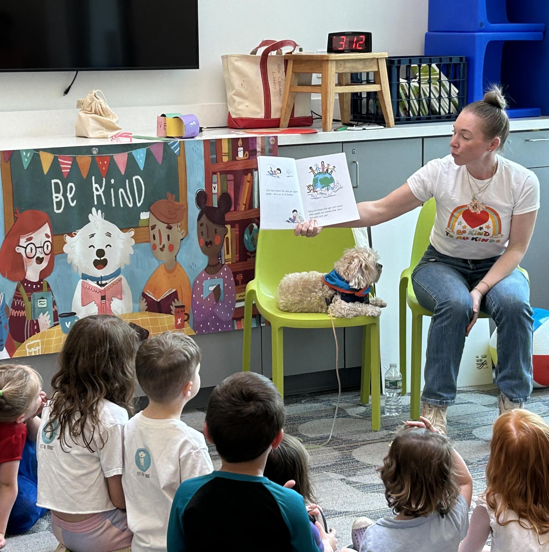 Cara reading to a class of young children